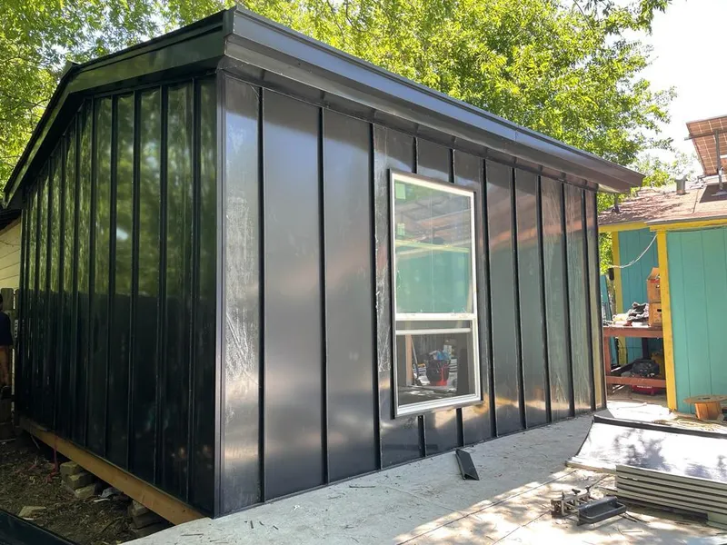 Black standing seam metal wall panels for Roof Inspection in Machesney Park