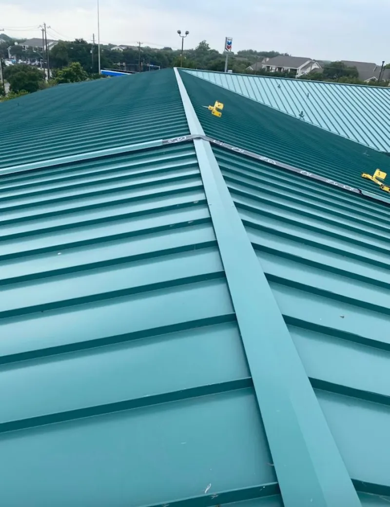 Green commercial metal roof ridge and valley for Metal Roof Repair in Machesney Park